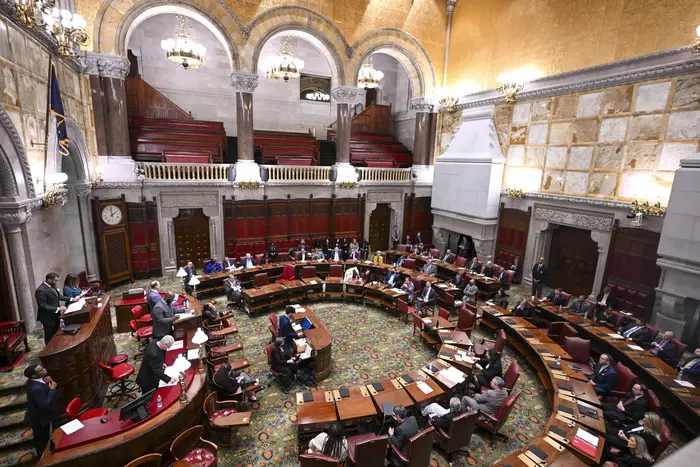 Members of the New York Assembly debate legislation to approve a legislative pay raise during a special legislative session in the Assembly Chamber at the state Capitol in Albany. Just in time for Christmas, New York legislators are set to give themselves a holiday gift: a pay raise that would make them the nation's best-paid state lawmakers